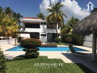 CASA AMUEBLADA FRENTE AL MAR - 5 HAB. / CONDOMINIO CHULAMAR — Casa en Venta en Puerto San José, Escuintla — miniatura 1 de 12